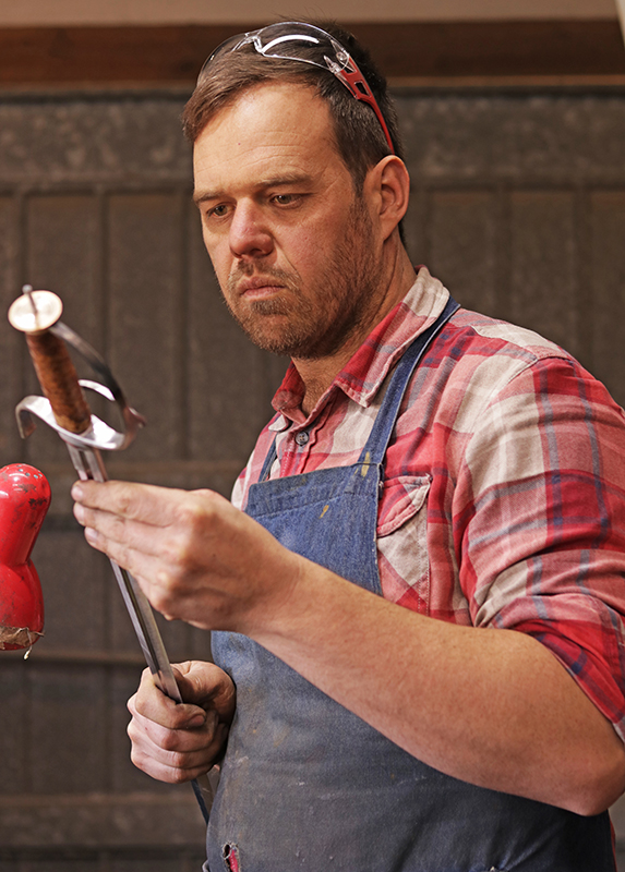 Rucus Coetzee admiring his hard work at the forge