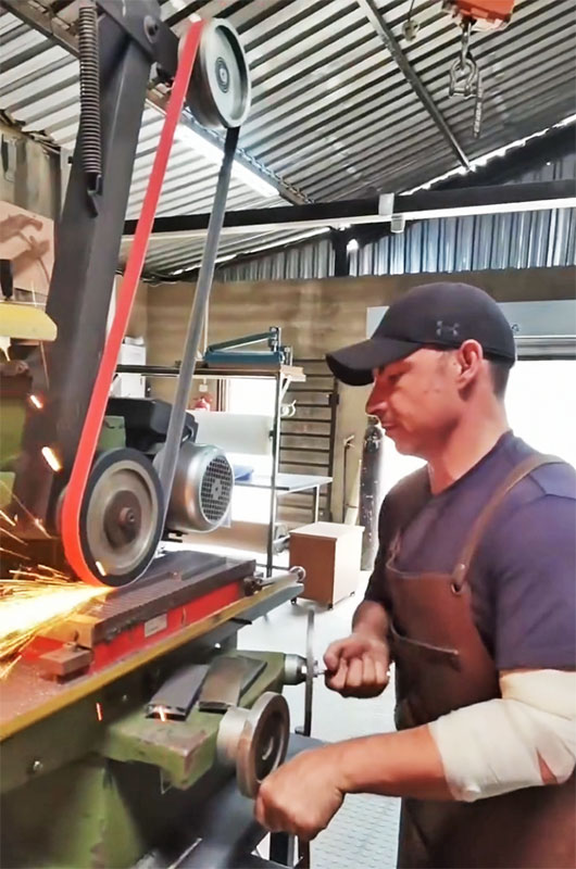 Journeyman Smith PJ Gouws at the surface grinder